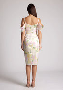 Back image of a model wearing a Floral Print Satin Bardot Midi Dress with a cowl neckline and invisible back zip with thin straps and draped arm bands, a design features Vesper Victoria Floral Print Satin Bardot Midi Dress