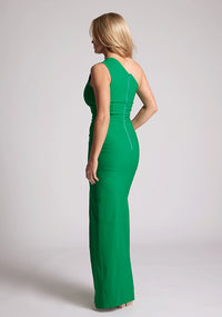 Back quarter image of a model wearing a emerald maxi dress, featuring a one shoulder with a cut out design. The dress featured is the Vesper Wren emerald maxi dress