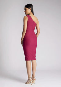 Back quarter image of a model wearing a berry midi dress, featuring a one shoulder design with a twisted band across the front. The dress featured is the Vesper Xyla berry midi dress
