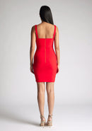 Back image of model wearing a red bodycon mini dress, the dress features a square neck line. The dress featured is the Vesper Carly red mini dress