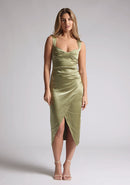 Front image of a model wearing a olive satin wrap midaxi dress, featuring a sweetheart neckline. The dress featured is the Vesper Desiree olive midaxi dress