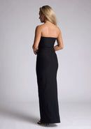 Back quarter image of a model wearing a black strapless maxi dress with a front split and centre back zip. The design featured is the Vesper Alaya Black Maxi Dress