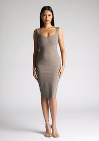 Front image of a model wearing a taupe midi bodycon dress with a soft v-neckline, bodycon fit, wide straps and centre-back zip. The design featured is the Vesper Azzura Tuape Midi Bodycon Dress