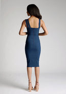 Back image of a model wearing a navy midi dress with a straight neckline and asymmetric straps. The design featured is the Vesper Bianca Navy Midi Dress