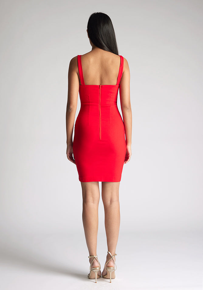 Back image of model wearing a red square neck mini dress with a chic square neckline and figure-hugging bodycon design. The dress featured is the Vesper Carly Red Square Neck Mini Dress