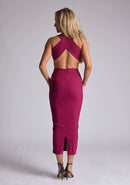 Back quarter image of the model wearing a berry bodycon midaxi dress with a plunge neckline and cut-out detailing. The design featured is the Vesper Cherry Berry Plunge Midaxi Dress