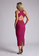 Back quarter image of the model wearing a berry bodycon midaxi dress with a plunge neckline and cut-out detailing. The design featured is the Vesper Cherry Berry Plunge Midaxi Dress