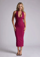 Front image of the model wearing a berry bodycon midaxi dress with a plunge neckline and cut-out detailing. The design featured is the Vesper Cherry Berry Plunge Midaxi Dress