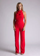 Front image of blonde model red collar detail jumpsuit with a strapless design and halter neck, this jumpsuit offers both comfort and sophistication. The designed featured is the Vesper Cindy Red Collar Detail Jumpsuit