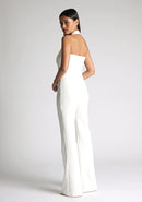 Back quarter image of model wearing a ivory wide leg trousers with a flattering high waist and wide leg design. The design featured is the Vesper Connie Ivory Wide Leg Trousers paired with Vesper Eve Ivory Waistcoat