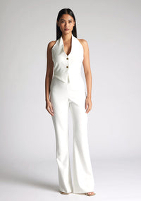 Front image of model wearing a ivory wide leg trousers with a flattering high waist and wide leg design. The design featured is the Vesper Connie Ivory Wide Leg Trousers paired with Vesper Eve Ivory Waistcoat