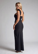 Bac Qaurter image of blonde model wearing a Black Collar Detail Maxi Dress with a  straight neckline and collar detailing at the neck, with straps at the back and a front skirt split, design features Vesper Dune Black Collar Detail Maxi 