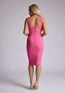 Back  image of blonde model wearing magenta midi dress with a wide straps and scoop neckline create a flattering fit, while the bodycon shape hugs your figure. The design featured is the Vesper Isabella Magenta Midi Dress