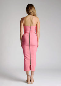 Back image of blonde model wearing a forest green midaxi dress with a alluring asymmetric design flatters every figure, while the bodycon silhouette accentuates your natural curves. The design featured is the Vesper Landen Fiesta Pink Dress