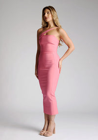 Front quarter image of blonde model wearing a forest green midaxi dress with a alluring asymmetric design flatters every figure, while the bodycon silhouette accentuates your natural curves. The design featured is the Vesper Landen Fiesta Pink Dress