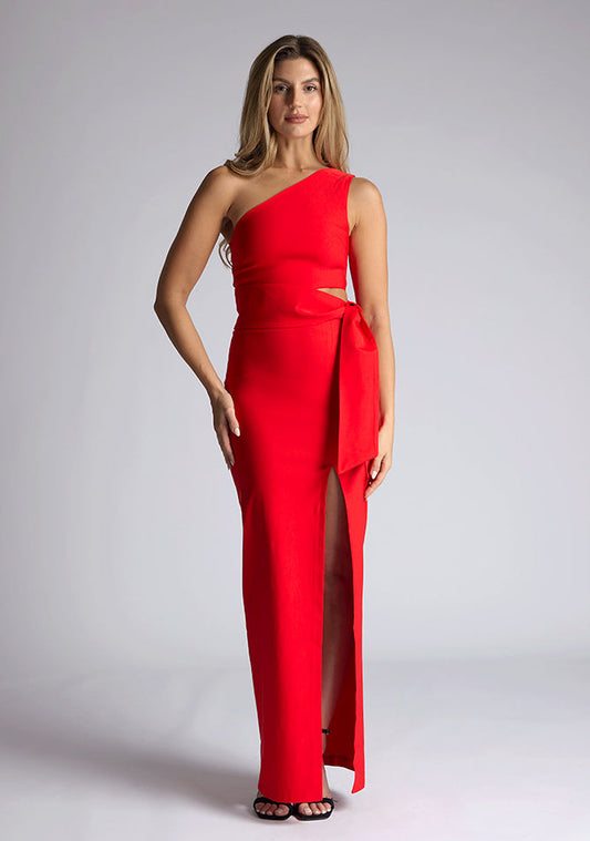 Front image of the model wearing an red maxi dress with a sleeveless stunner boasts an asymmetric design and a flattering wrap belt and front skirt split. The design featured is the Vesper Lisbeth Red Maxi Dress