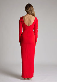 Back image of a model wearing a red maxi dress with long sleeves, front skirt split and a low back. The design featured is the Vesper Mandy Red Long Sleeve Maxi Dress