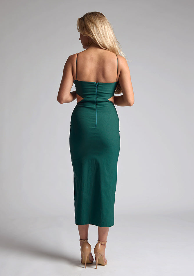 Back image of blonde model wearing a Forest Green Midaxi Dress with a scoop neckline and thin straps, front skirt split and a bodycon fit. The design features  is Vesper Marilynn Forest Green Midaxi Dress