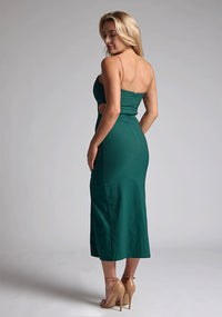 Back quarter image of blonde model wearing a Forest Green Midaxi Dress with a scoop neckline and thin straps, front skirt split and a bodycon fit. The design features  is Vesper Marilynn Forest Green Midaxi Dress