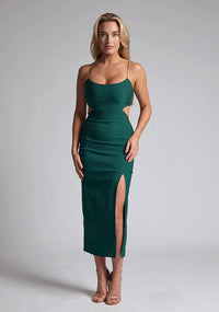 Front image of blonde model wearing a Forest Green Midaxi Dress with a scoop neckline and thin straps, front skirt split and a bodycon fit. The design features  is Vesper Marilynn Forest Green Midaxi Dress