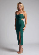 Front quarter  image of blonde model wearing a Forest Green Midaxi Dress with a scoop neckline and thin straps, front skirt split and a bodycon fit. The design features  is Vesper Marilynn Forest Green Midaxi Dress