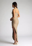 Back image of model wearing a taupe one shoulder maxi dress with a asymmetrical neckline, one-shoulder design, and a leg split. The design featured is the  Vesper Melanie Taupe One Shoulder Maxi Dress