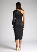 Back image of a model wearing an black midi dress, featuring an asymmetric neckline with one long sleeve, with a side waist cut-out detail.The dress featured is the Vesper Niccola Black Satin Midi Dress
