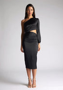 Front image of a model wearing an black midi dress, featuring an asymmetric neckline with one long sleeve, with a side waist cut-out detail.The dress featured is the Vesper Niccola Black Satin Midi Dress
