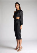 Front quarter image of a model wearing an black midi dress, featuring an asymmetric neckline with one long sleeve, with a side waist cut-out detail.The dress featured is the Vesper Niccola Black Satin Midi Dress