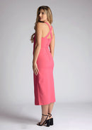 Back quarter image of model wearing a pink sweetheart midaxi dress with a plunge sweetheart neckline with wide straps that cross at the back and a front skirt split. The design featured is the Vesper Poppy Pink Sweetheart Midaxi Dress