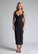 Front image of a model wearing a black midaxi dress with a sweetheart neckline with wide straps, a side cut-out and front skirt split. The design featured is the Vesper Porticini Black Cut Out Midaxi Dress