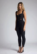 Front qaurter image of a model wearing a black high waist trousers with a  high waist and fitted silhouette create a flattering shape, while the small splits at the front add a touch of elegance.The design featured is the Vesper Raven Black High Waist Trousers pair with Vesper Juno Black Crop Top