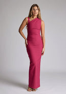 Front image of a model wearing a raspberry asymmetric maxi dress with a asymmetric neckline silhouette, back skirt split and ruched detailing enhances the dress's allure. The design featured is the Vesper Wyatt Raspberry Asymmetric Maxi Dress