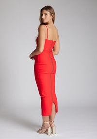 Back quarter image of the model wearing a red midaxi dress with a sweetheart neckline that accentuates your neckline beautifully, bodycon fit and centre gold back zip. The design featured is the Vesper Zoya Red Midaxi Dress