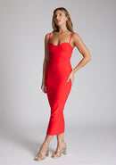 Front quarter image of the model wearing a red midaxi dress with a sweetheart neckline that accentuates your neckline beautifully, bodycon fit and centre gold back zip. The design featured is the Vesper Zoya Red Midaxi Dress